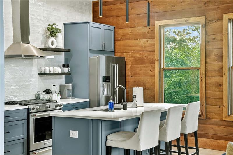 351 South Dream Catcher Blue Ridge, GA 30513 - Photo 12 of 52 a kitchen with a table chairs and window