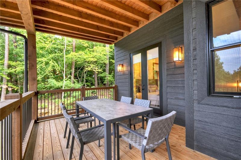 351 South Dream Catcher Blue Ridge, GA 30513 - Photo 19 of 52 a view of a patio with table and chairs and wooden floor