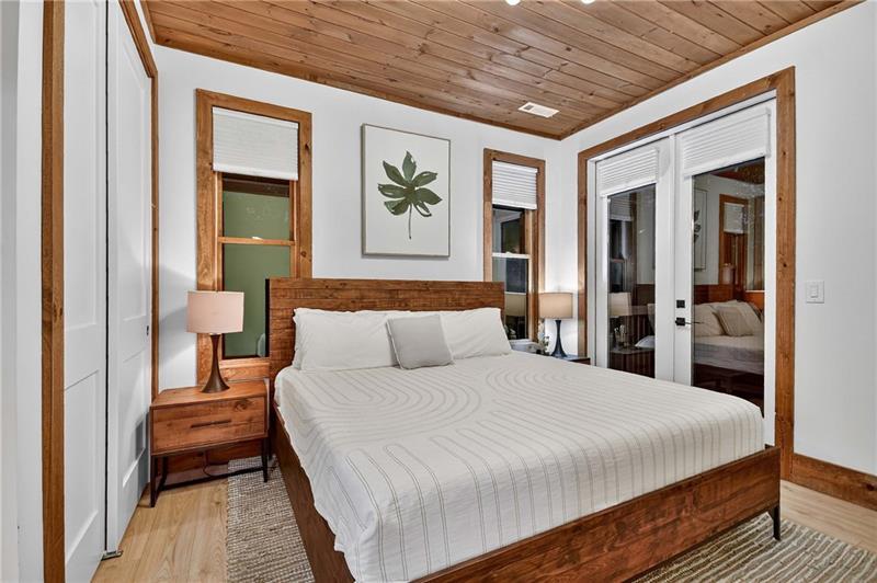 351 South Dream Catcher Blue Ridge, GA 30513 - Photo 21 of 52 a bedroom with a large bed and a chandelier