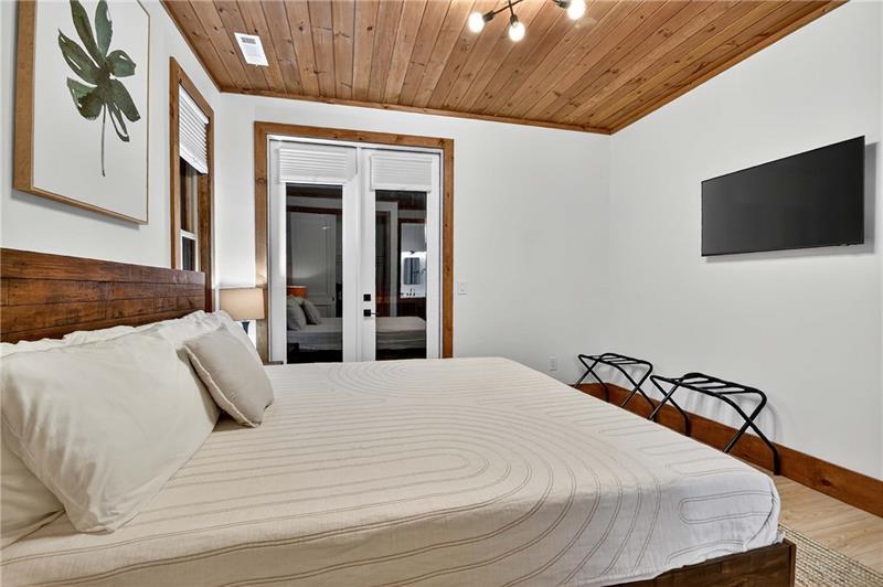 351 South Dream Catcher Blue Ridge, GA 30513 - Photo 22 of 52 a bedroom with a bed and a flat screen tv