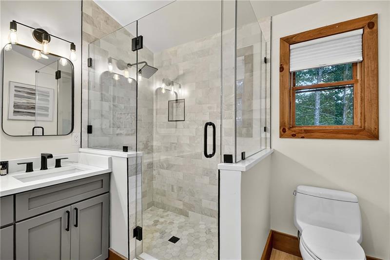 351 South Dream Catcher Blue Ridge, GA 30513 - Photo 28 of 52 a bathroom with a granite countertop sink a toilet and shower