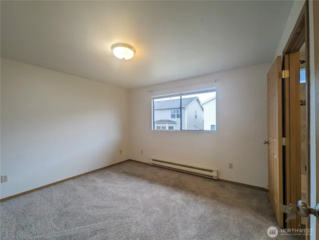 an empty room with a empty space and windows