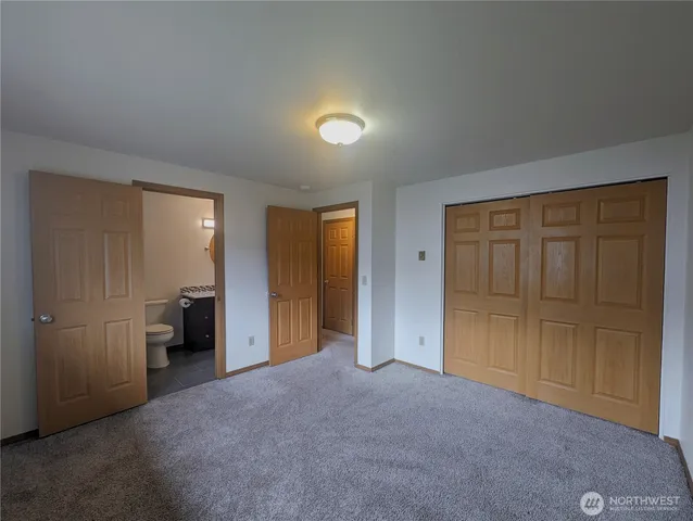 a view of empty room with closet area