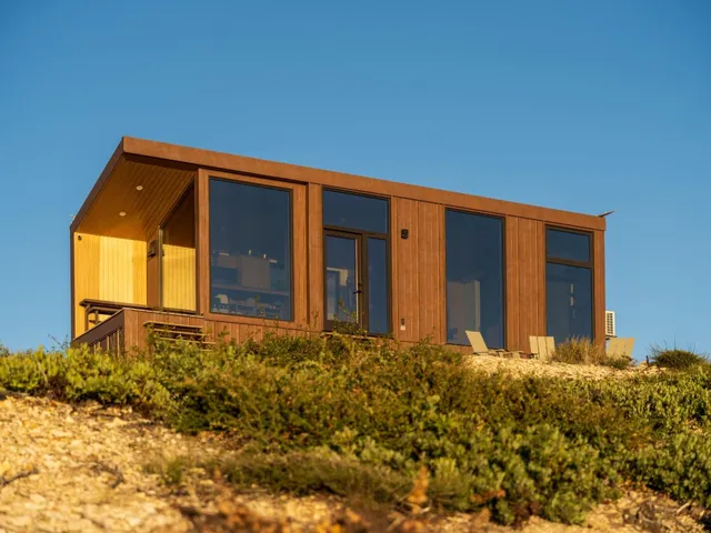 a view of a terrace with couches and wooden floor