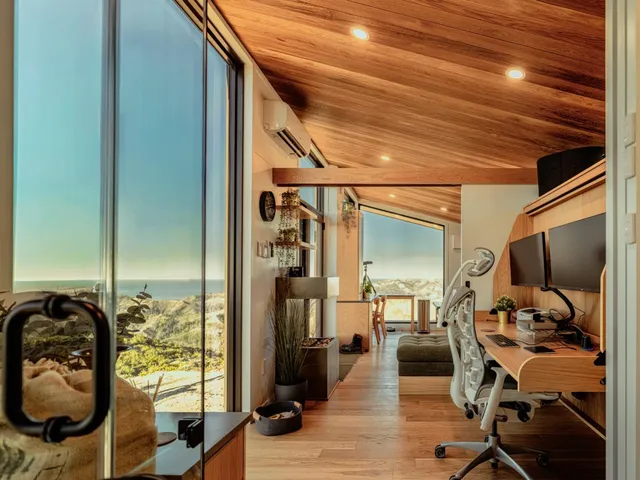 a bedroom with furniture and a wooden floor