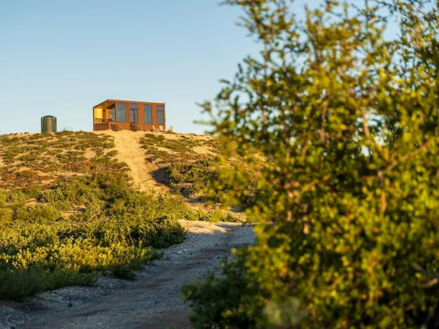 a close up of a utility room with racks on the wall