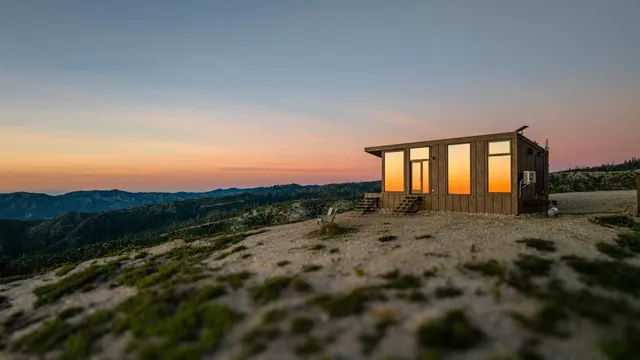 a view of a kitchen with furniture and wooden floor