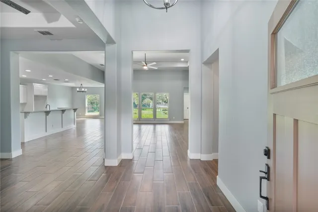 a view of an entryway of a house and wooden floor