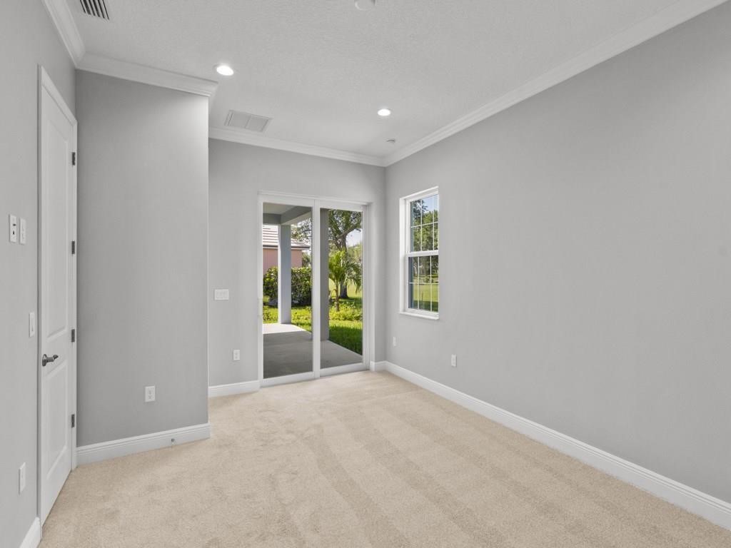 1891 East Cayman Road Vero Beach, FL 32963 - Photo 14 of 27 a view of an empty room with a window