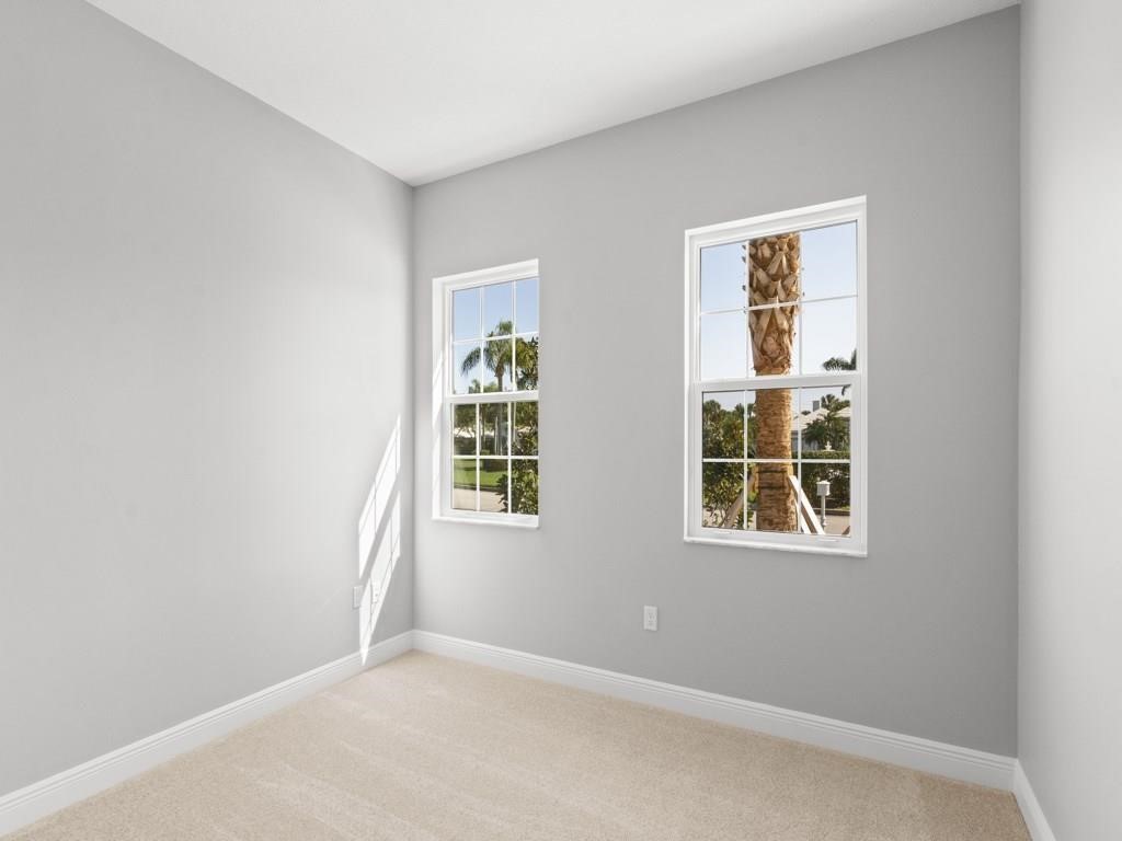 1891 East Cayman Road Vero Beach, FL 32963 - Photo 18 of 27 an empty room with windows