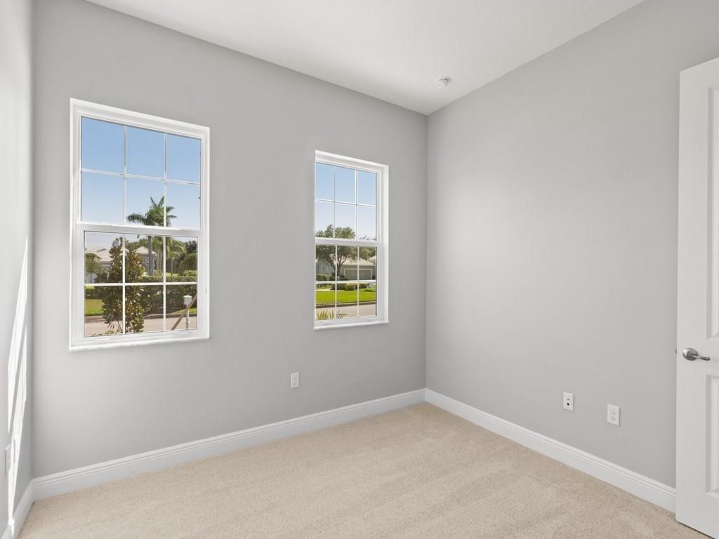 1891 East Cayman Road Vero Beach, FL 32963 - Photo 19 of 27 an empty room with a window