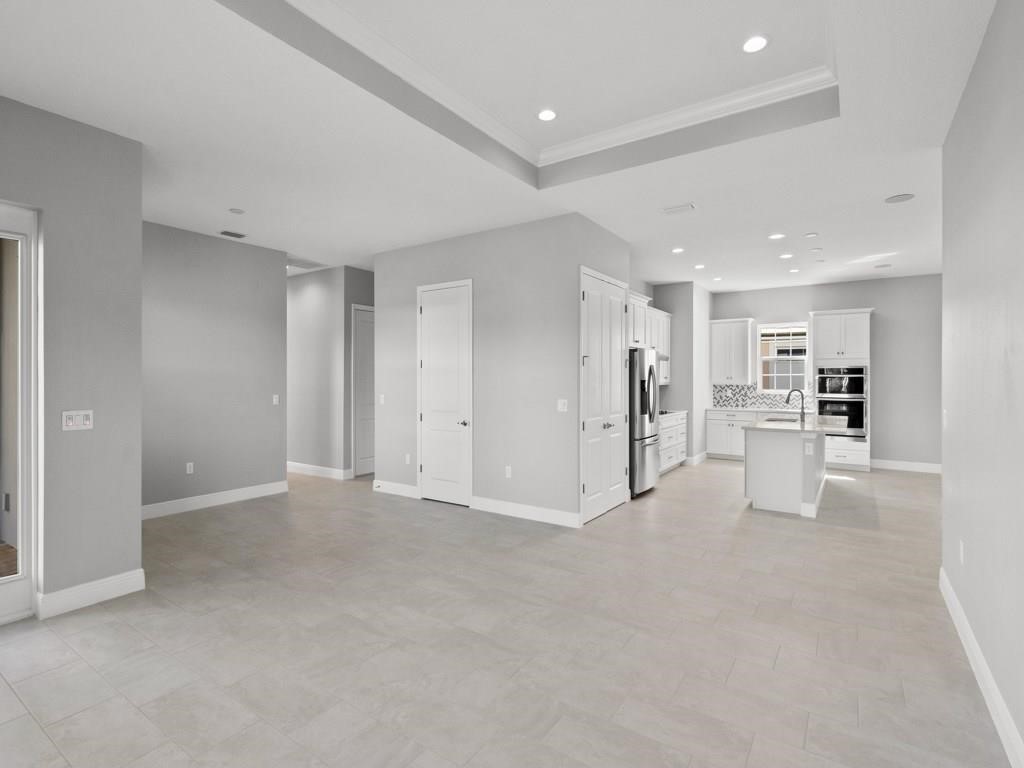 1891 East Cayman Road Vero Beach, FL 32963 - Photo 2 of 27 a view of a big room with white walls