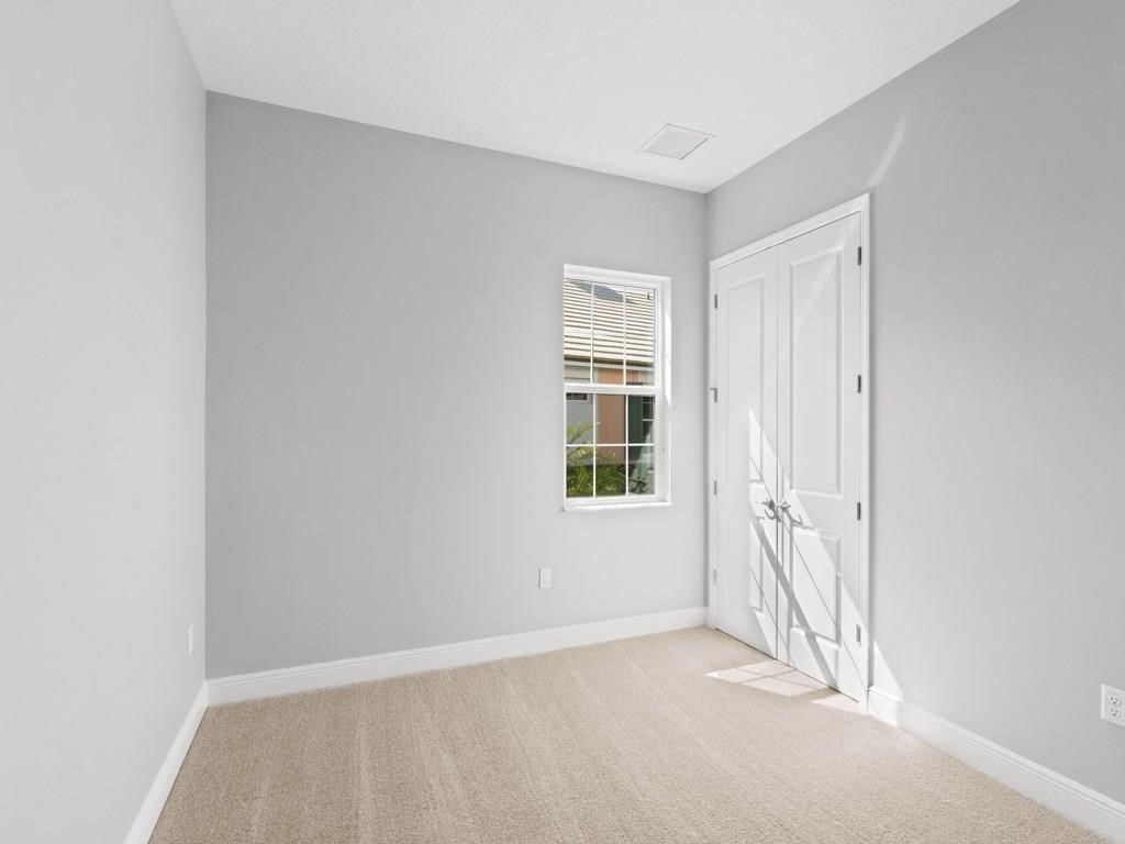 1891 East Cayman Road Vero Beach, FL 32963 - Photo 21 of 27 an empty room with windows