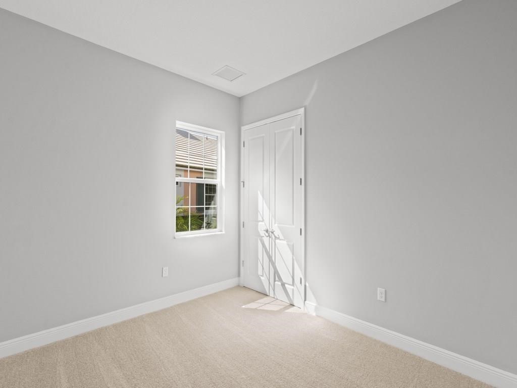 1891 East Cayman Road Vero Beach, FL 32963 - Photo 22 of 27 an empty room with windows