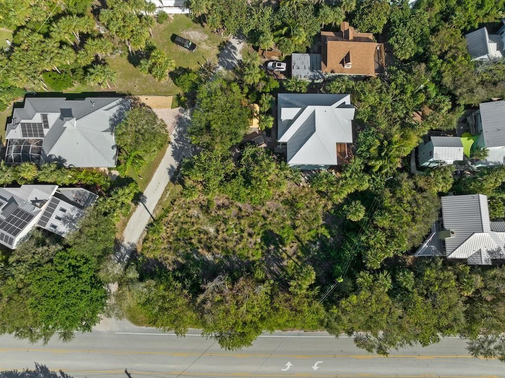 1891 East Cayman Road Vero Beach, FL 32963 - Photo 26 of 27 an aerial view of a house with yard and outdoor seating