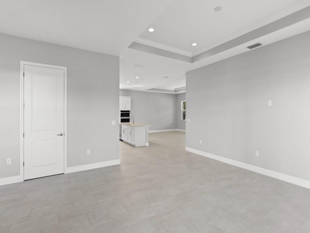1891 East Cayman Road Vero Beach, FL 32963 - Photo 3 of 27 a view of a big room with white walls