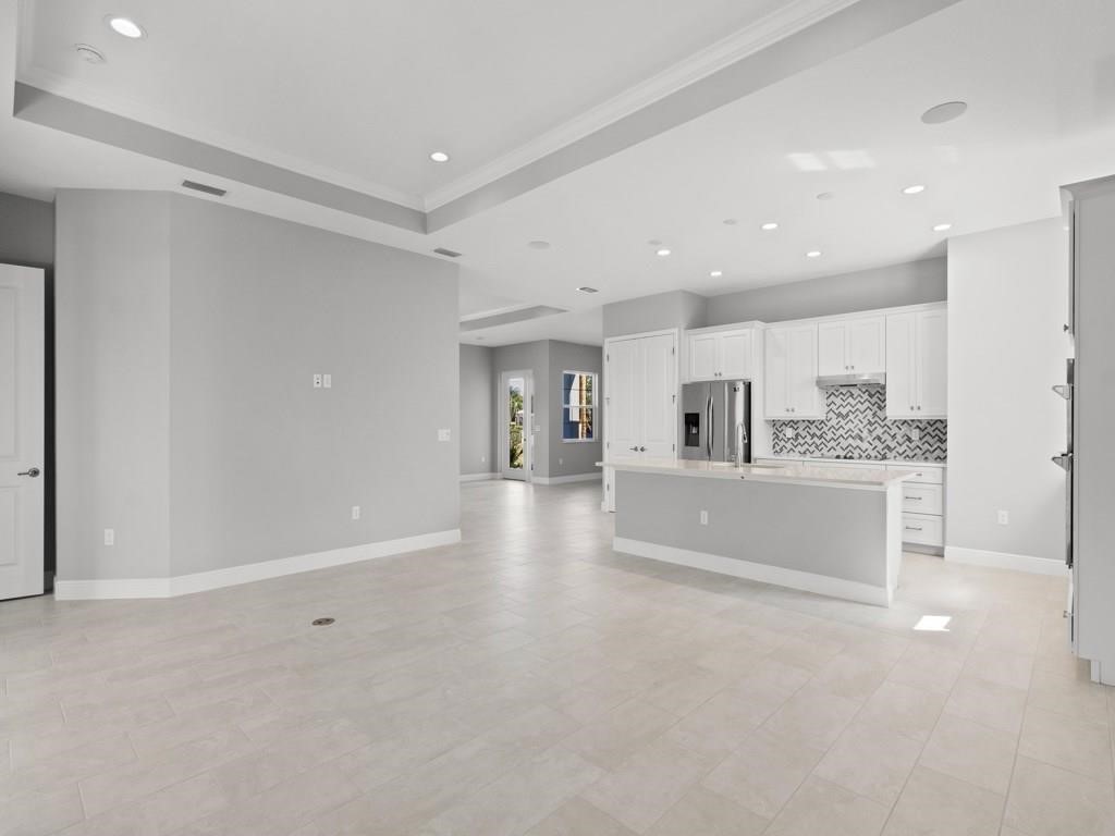 1891 East Cayman Road Vero Beach, FL 32963 - Photo 9 of 27 a view of large windows in a room