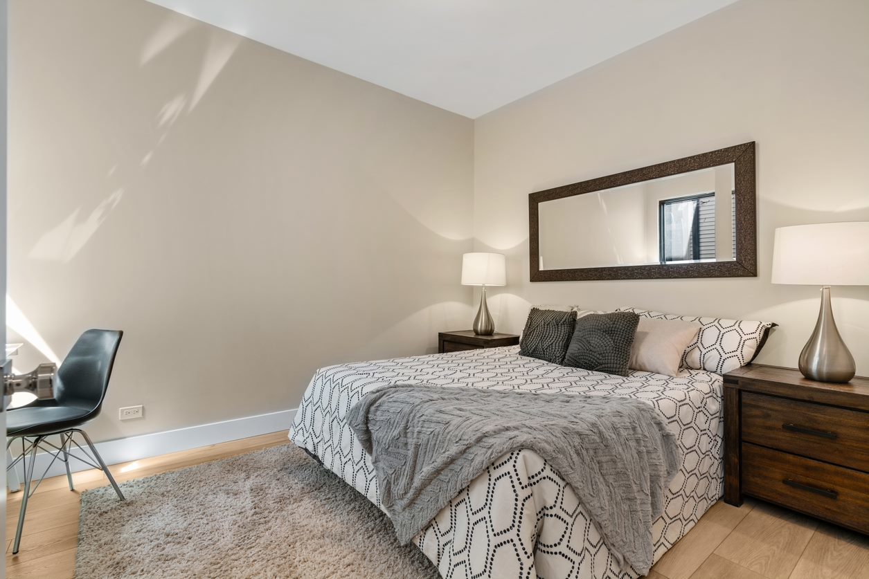 Undisclosed Address Chicago, IL 60657 - Photo 15 of 22 a bedroom with a bed and chair