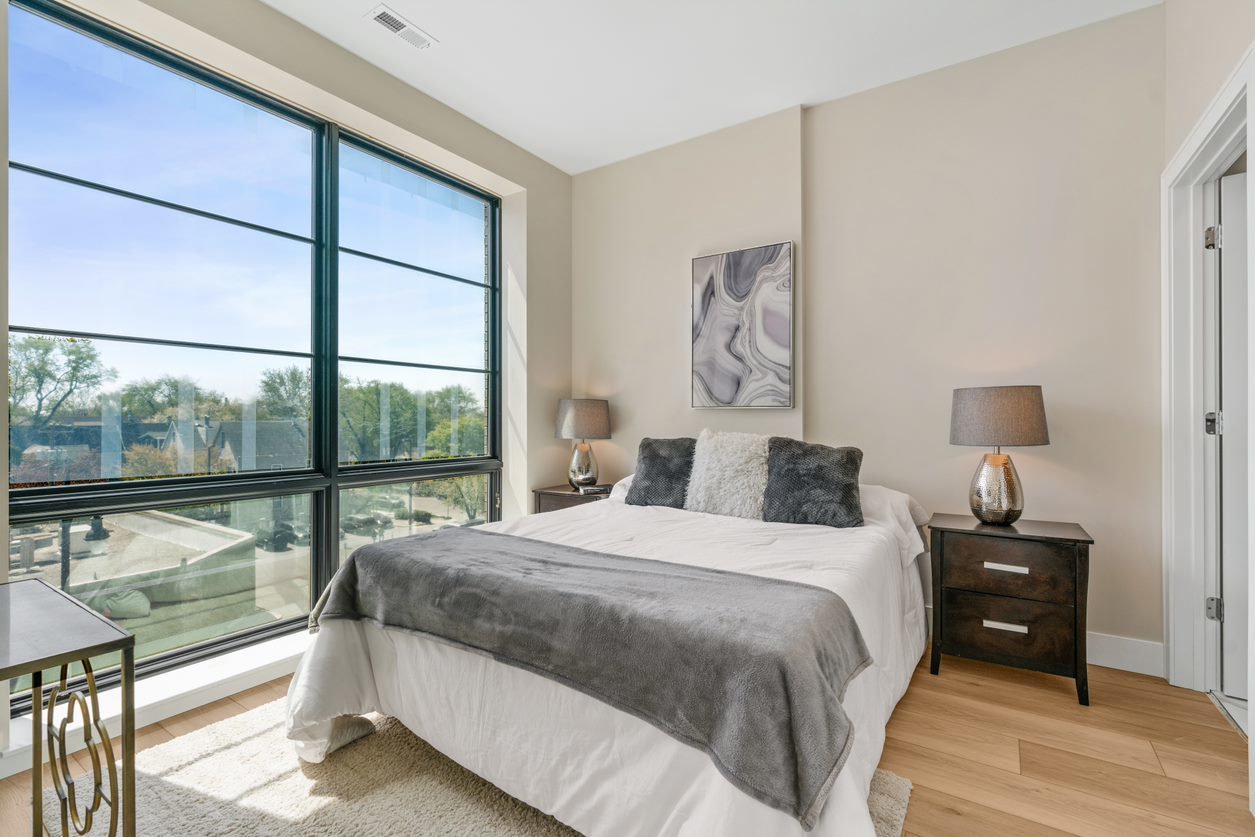 Undisclosed Address Chicago, IL 60657 - Photo 19 of 22 a bedroom with a bed and a night stand