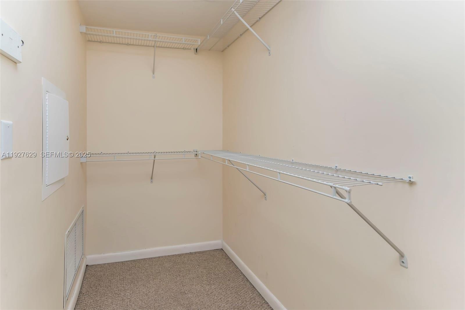 7355 Southwest 89th Street, Unit 721N Miami, FL 33156 - Photo 13 of 29 a view of a room with racks on the wall