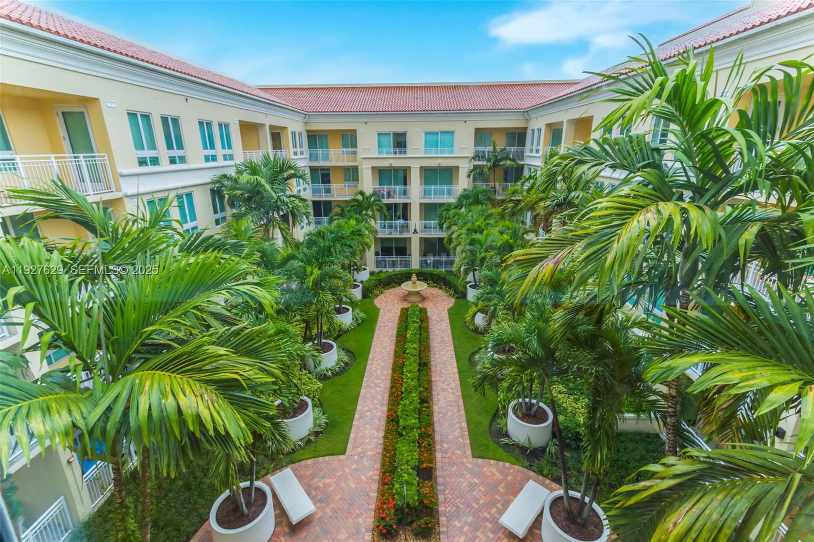 7355 Southwest 89th Street, Unit 721N Miami, FL 33156 - Photo 19 of 29 a front view of a house with a yard