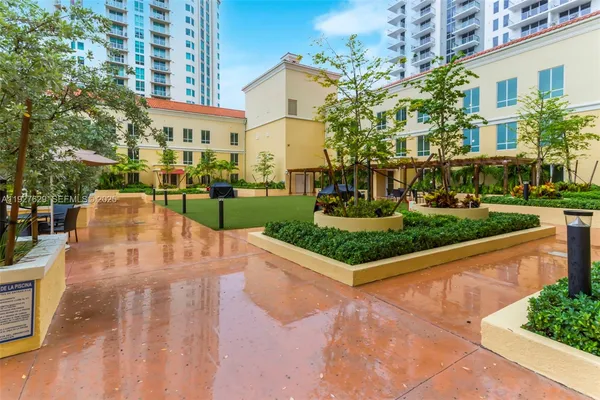 a view of a house with backyard and porch