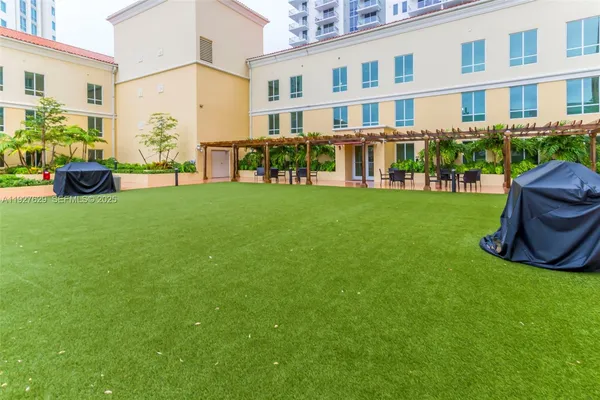 a view of a swimming pool with outdoor seating