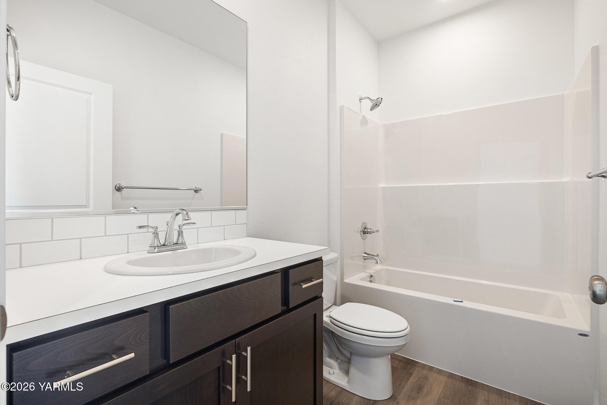 1603 Diamond Avenue Grandview, WA 98930 - Photo 11 of 32 a bathroom with a sink a toilet and shower