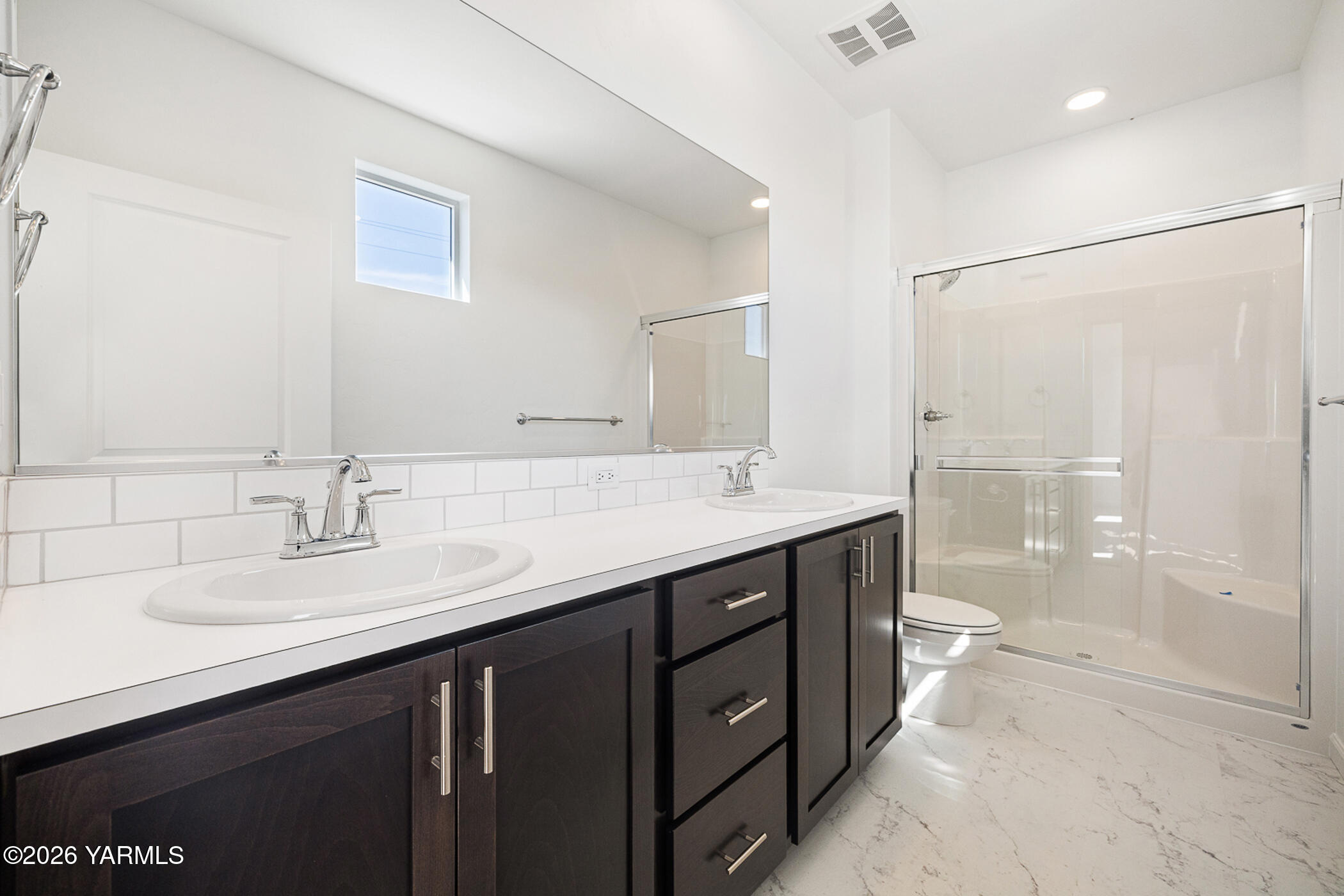 1603 Diamond Avenue Grandview, WA 98930 - Photo 18 of 32 a bathroom with a double vanity sink mirror double and shower