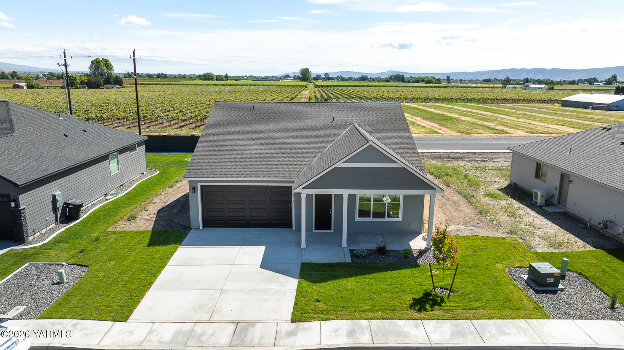 1603 Diamond Avenue Grandview, WA 98930 - Photo 27 of 32 a view of a house with a yard and a patio