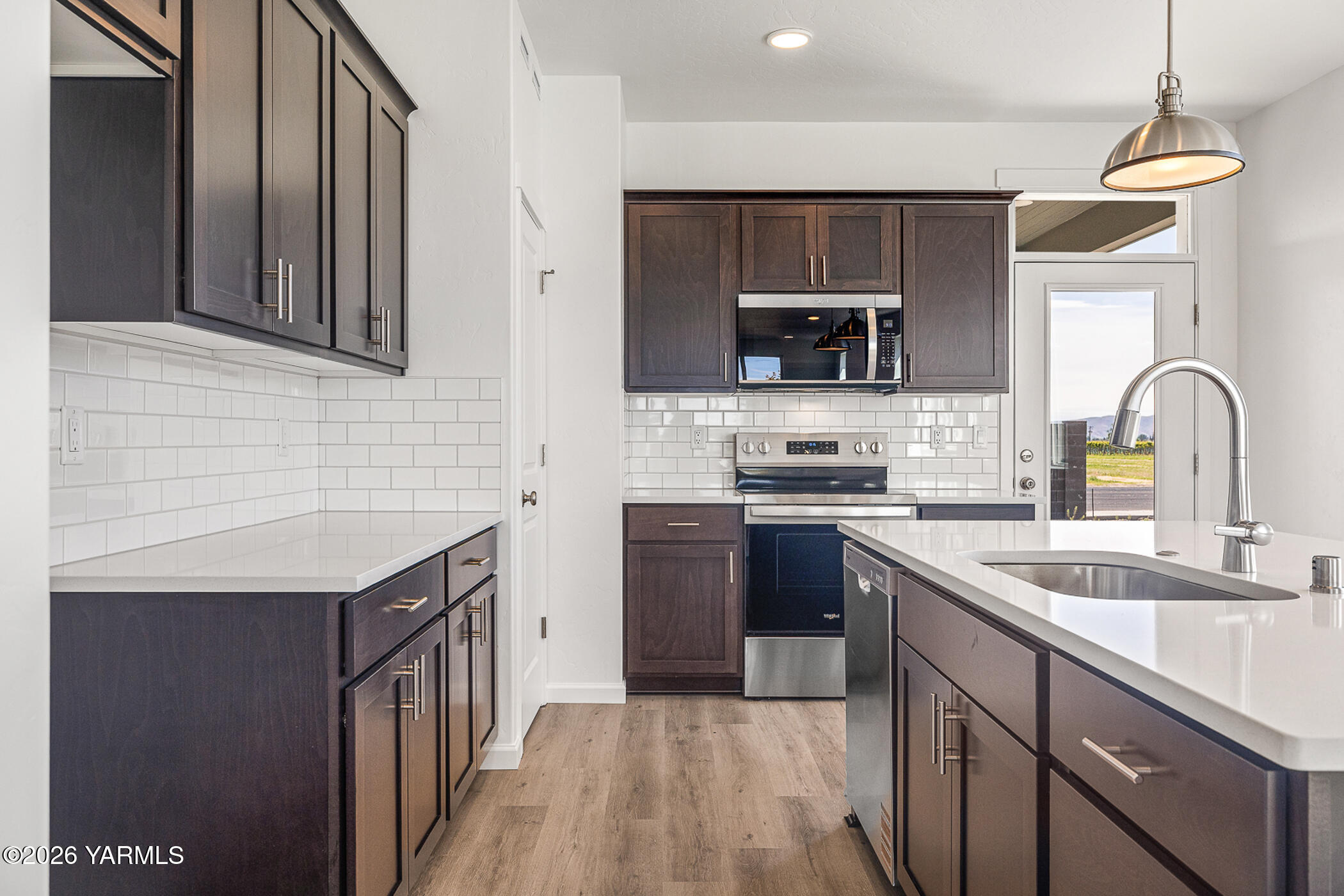 1603 Diamond Avenue Grandview, WA 98930 - Photo 7 of 32 a kitchen with a sink stove top oven and refrigerator
