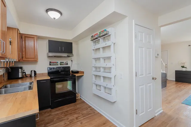 a kitchen with stainless steel appliances granite countertop a stove and a refrigerator