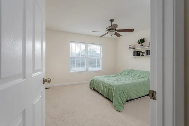 a living room with couch and a window