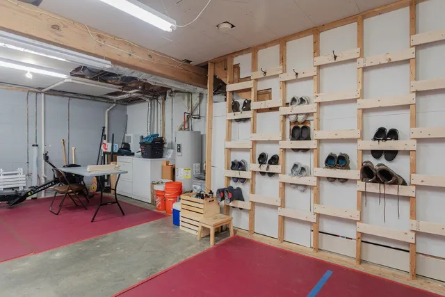 a living room with furniture cabinets and a rug