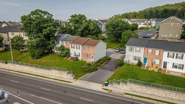 a aerial view of a house with yard and sitting area