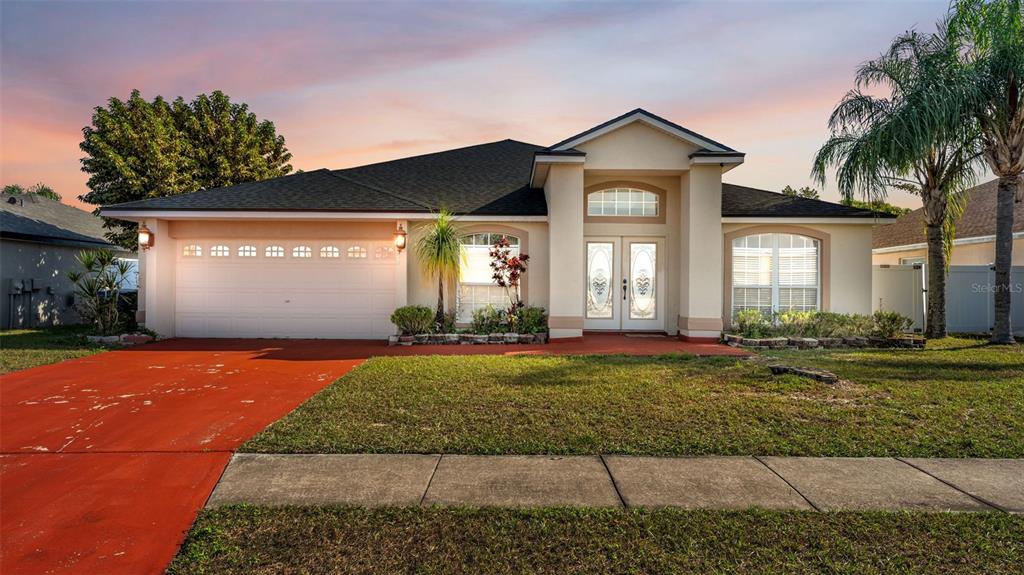 587 Drayton Road Winter Haven, FL 33884 - Photo 1 of 40 a front view of a house with garden