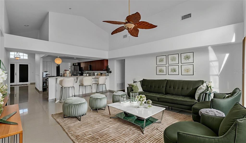 587 Drayton Road Winter Haven, FL 33884 - Photo 15 of 40 a living room with furniture and a flat screen tv