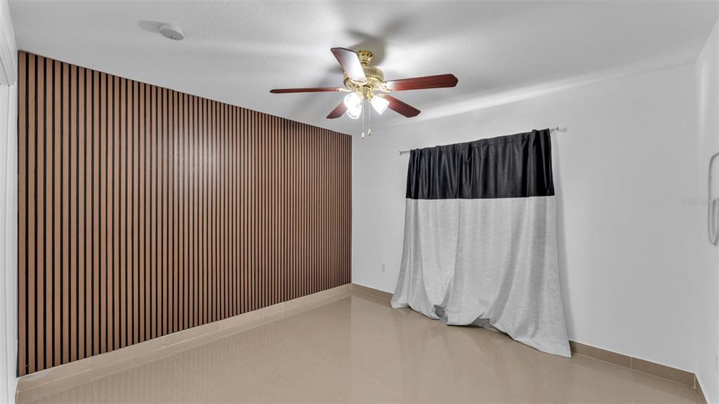 587 Drayton Road Winter Haven, FL 33884 - Photo 21 of 40 a view of a livingroom with a fan