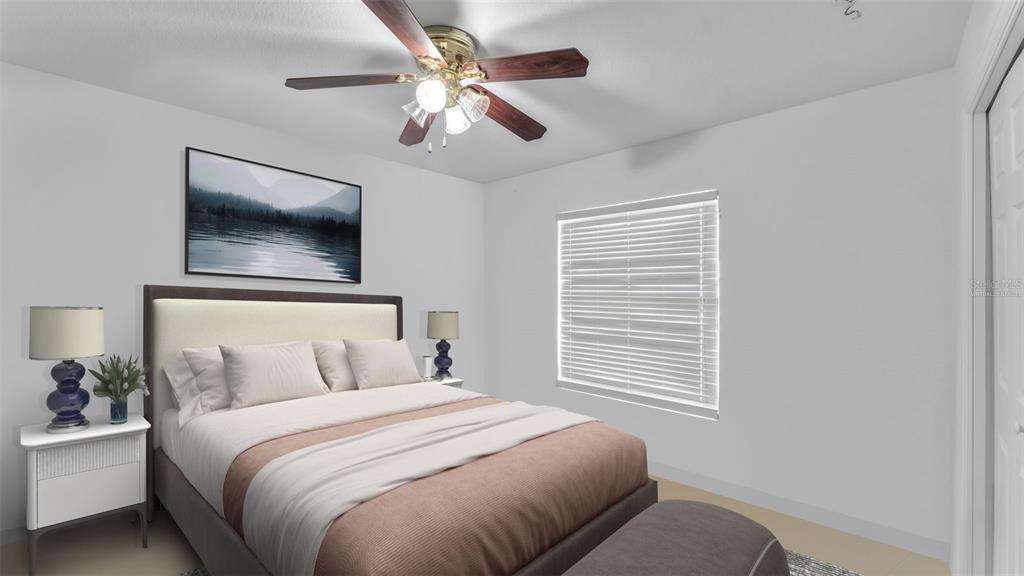 587 Drayton Road Winter Haven, FL 33884 - Photo 24 of 40 a bedroom with a large bed and a window