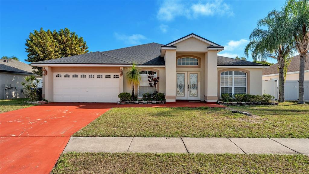 587 Drayton Road Winter Haven, FL 33884 - Photo 3 of 40 a front view of a house with garden