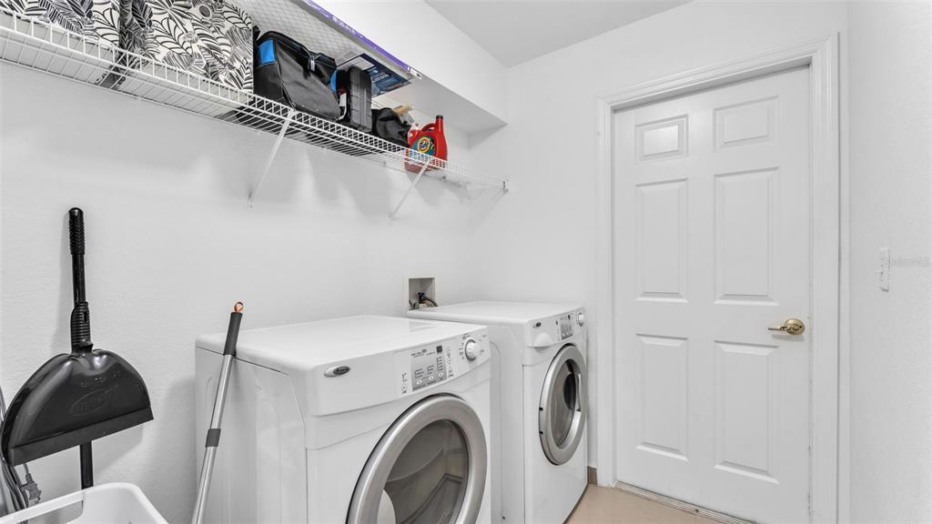 587 Drayton Road Winter Haven, FL 33884 - Photo 31 of 40 a utility room with dryer and washer