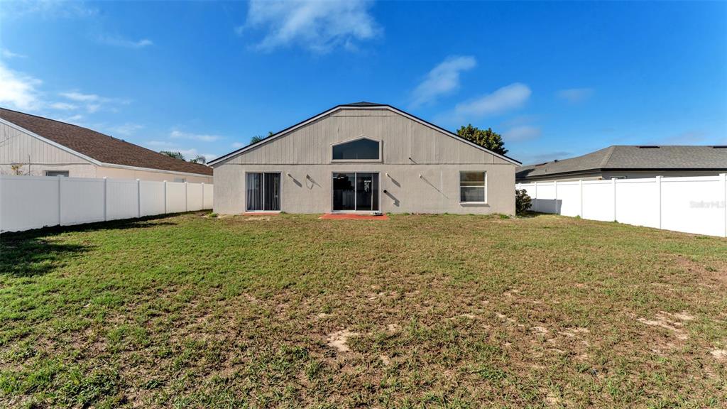 587 Drayton Road Winter Haven, FL 33884 - Photo 33 of 40 a view of a house with a yard
