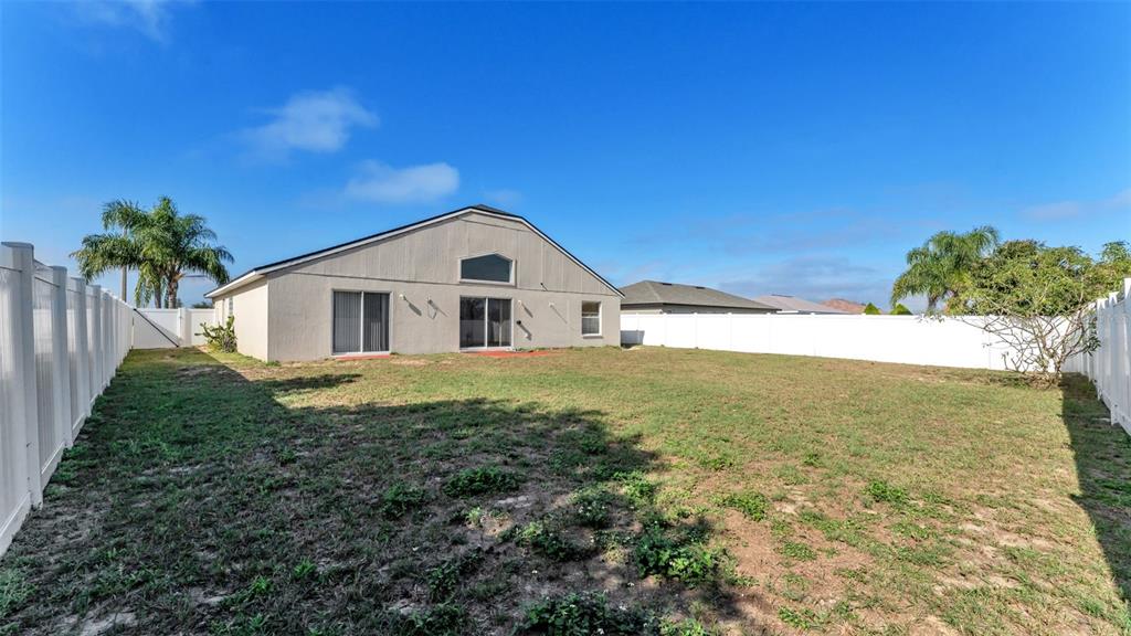 587 Drayton Road Winter Haven, FL 33884 - Photo 34 of 40 a view of a house with a yard