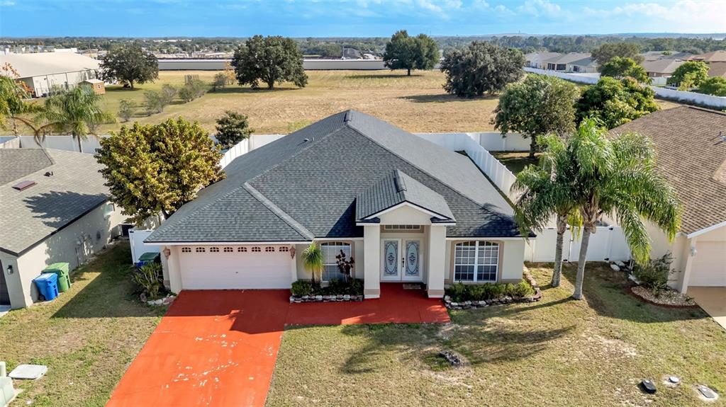 587 Drayton Road Winter Haven, FL 33884 - Photo 35 of 40 a view of a house with outdoor space and sitting area