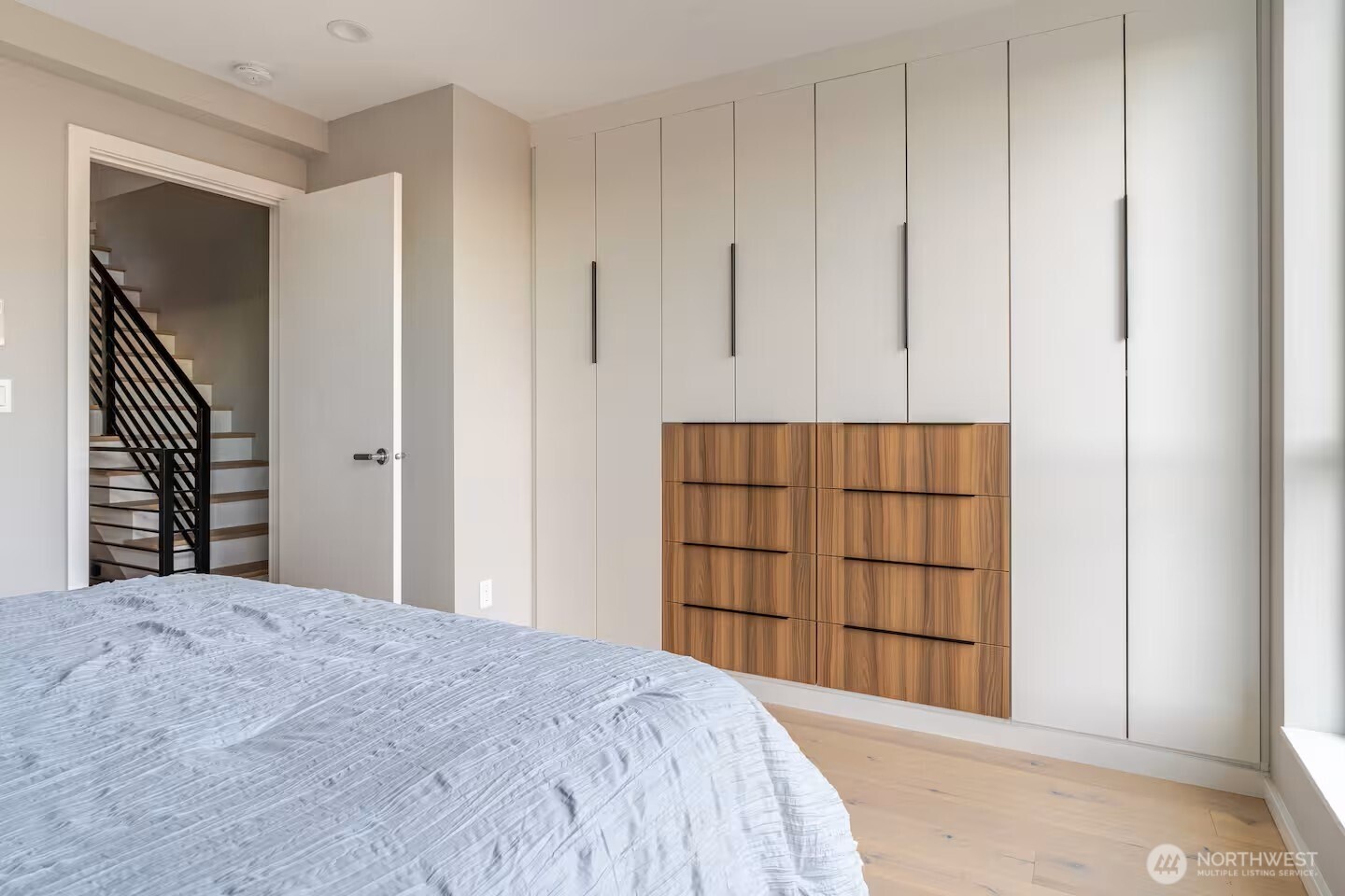 1709 20th Avenue, Unit A Seattle, WA 98122 - Photo 17 of 20 a bed room with a bed and a closet