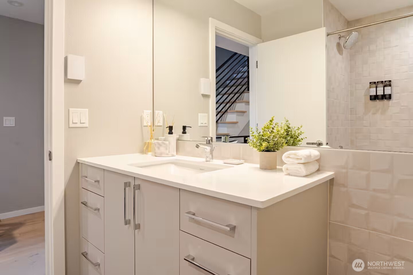 1709 20th Avenue, Unit A Seattle, WA 98122 - Photo 18 of 20 a bathroom with a sink and a mirror