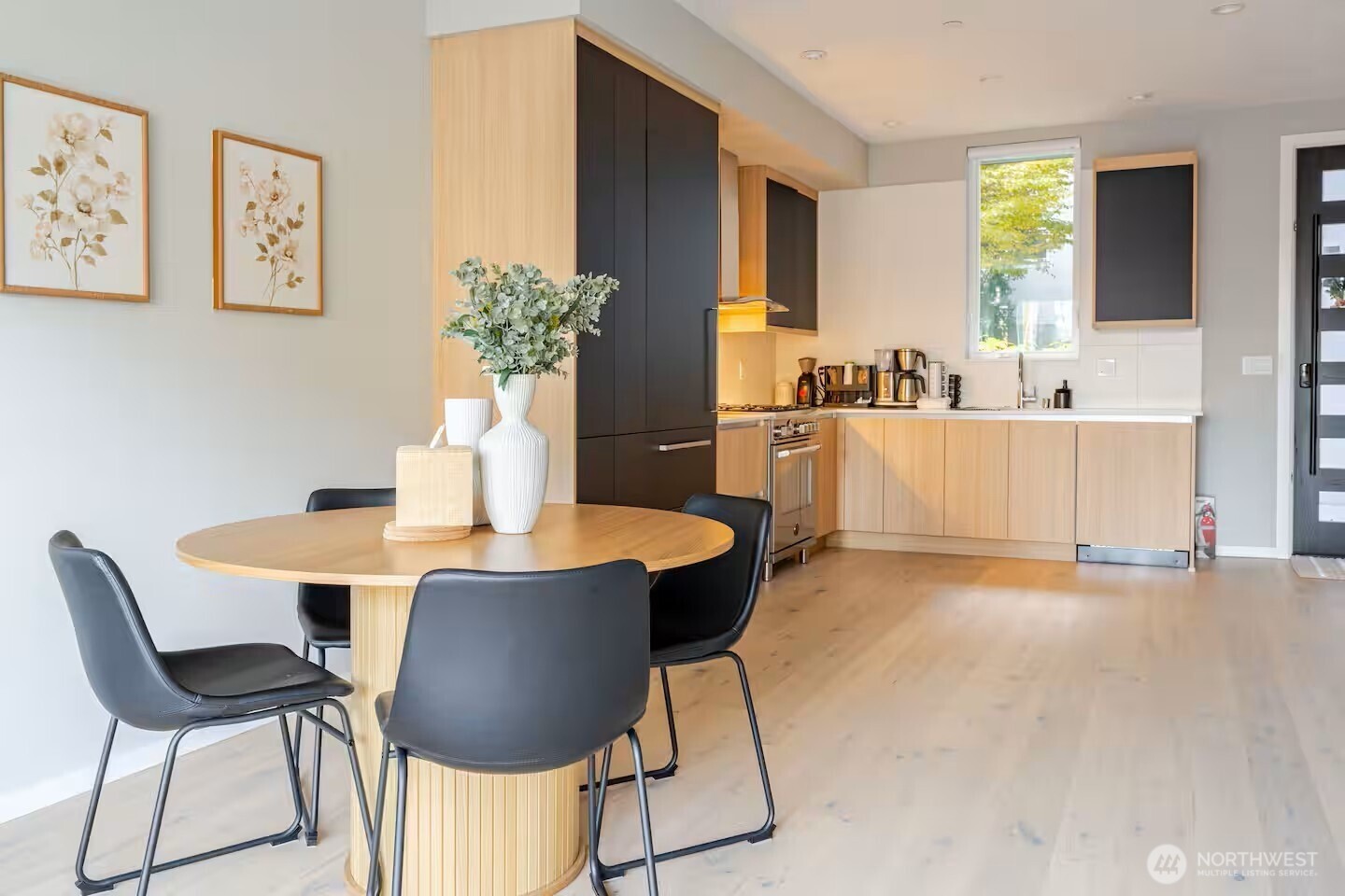 1709 20th Avenue, Unit A Seattle, WA 98122 - Photo 4 of 20 a view of a dining room with furniture and wooden floor