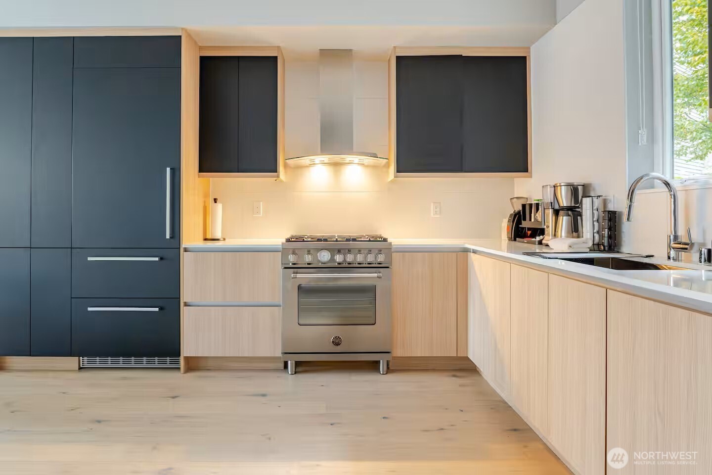 1709 20th Avenue, Unit A Seattle, WA 98122 - Photo 5 of 20 a kitchen with a sink and a stove top oven