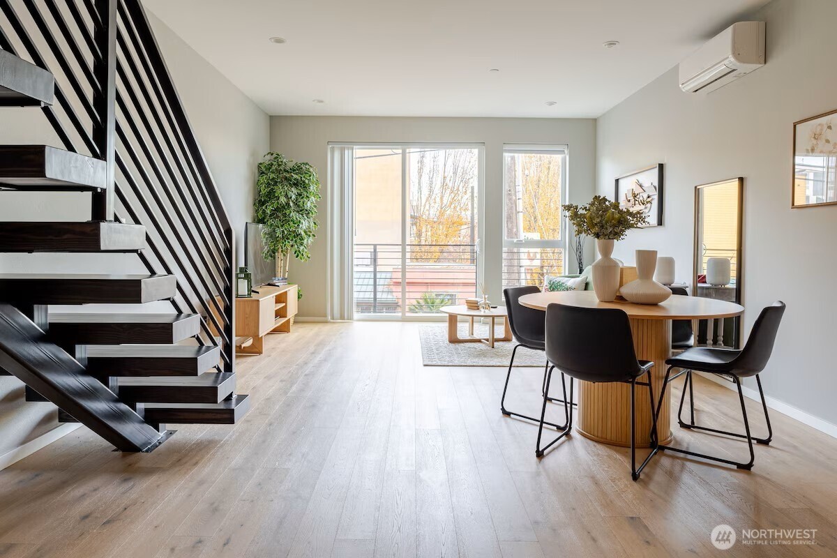 1709 20th Avenue, Unit A Seattle, WA 98122 - Photo 6 of 20 a view of a livingroom with furniture wooden floor and windows