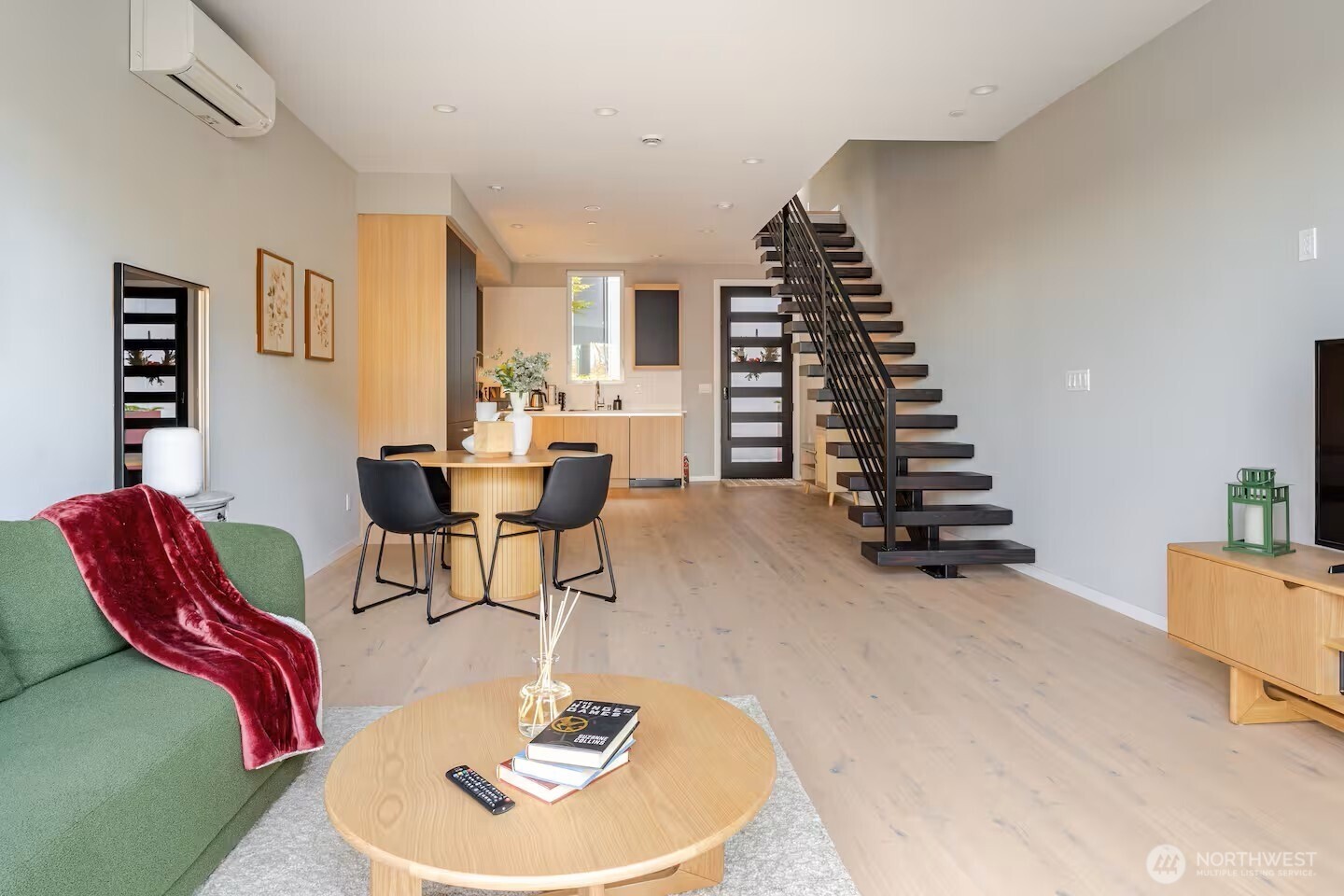 1709 20th Avenue, Unit A Seattle, WA 98122 - Photo 7 of 20 a dining room with furniture and wooden floor